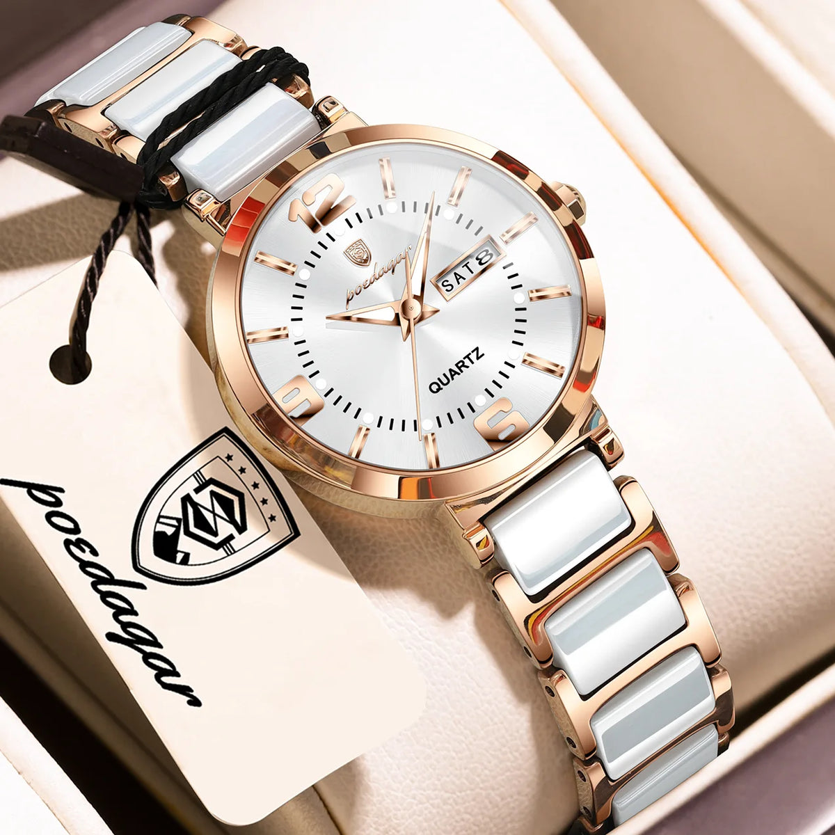A women's quartz watch with a rose gold-tone metal bracelet and case, featuring a white dial with gold-tone markers and a date window. The bracelet is accented with glossy white ceramic links.