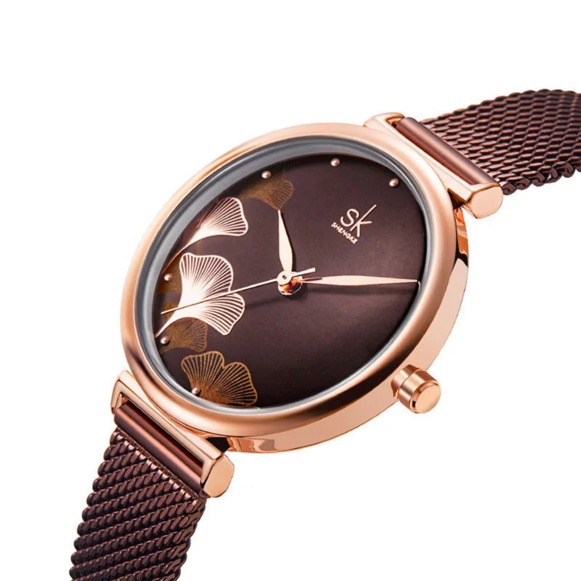 Rose gold watch with brown floral design on the dial against a white background