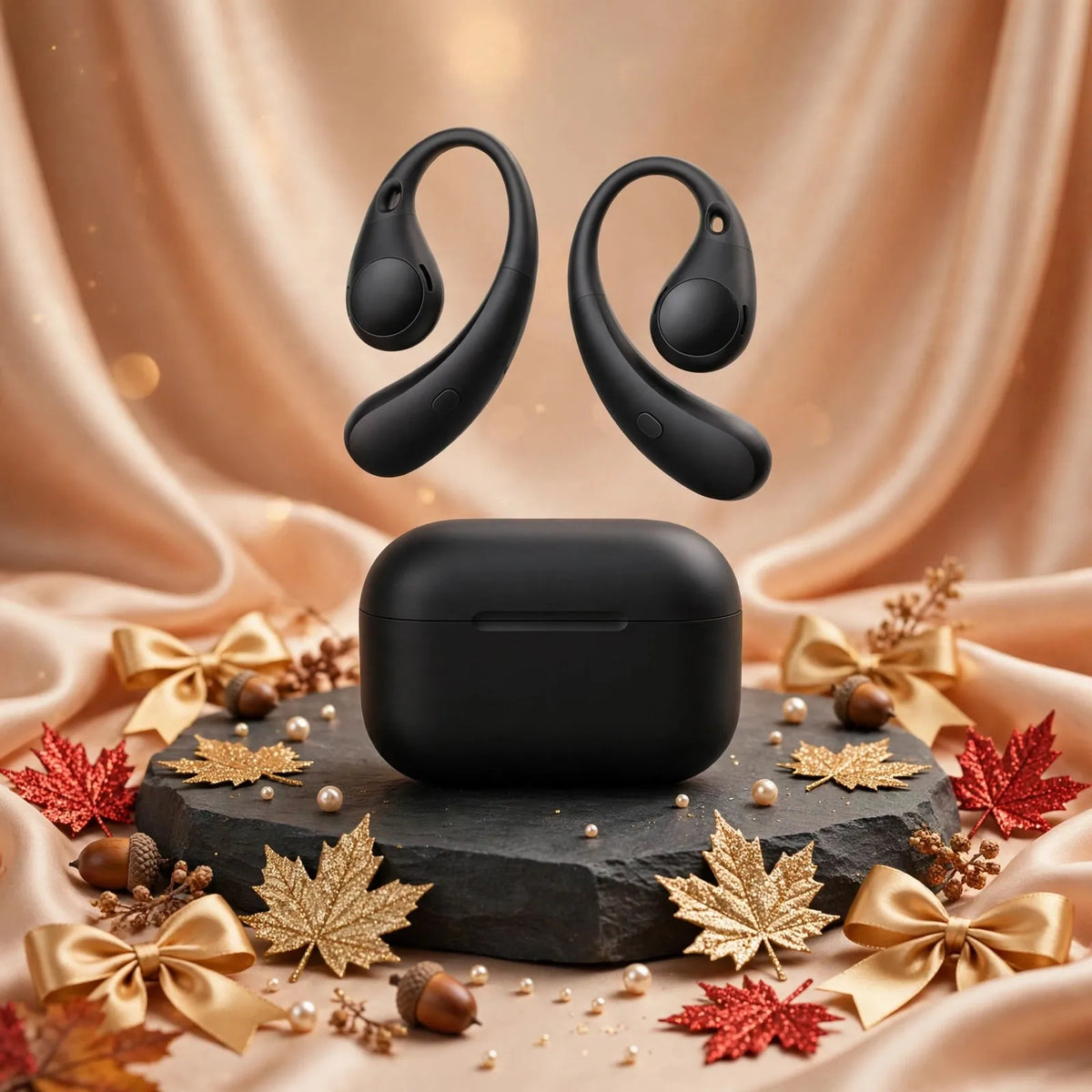 Black open ear wireless earphones with case on slate podium, luxury champagne silk background with gold red maple leaves pearls acorns - Goldener Wahl