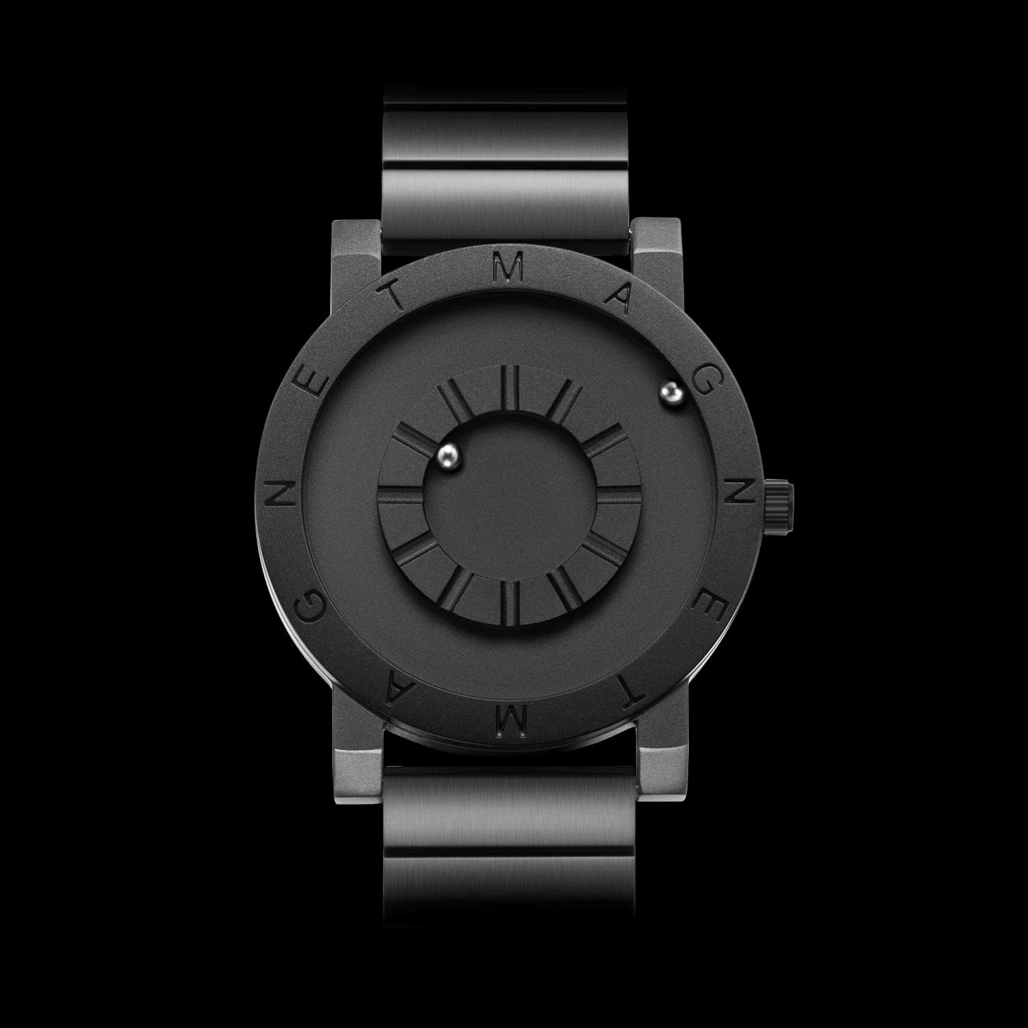 Black magnetic watch with metallic band on a black background