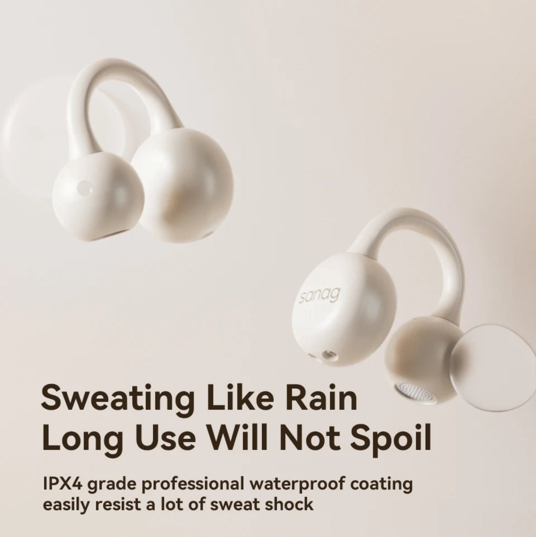 White wireless earbuds with text on a light beige background