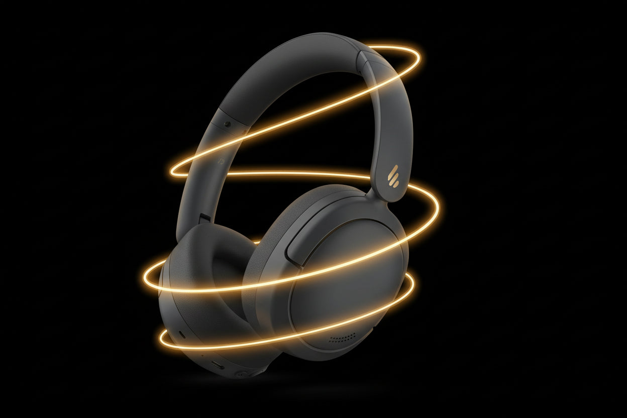 Black headphones with glowing yellow accents on a white background