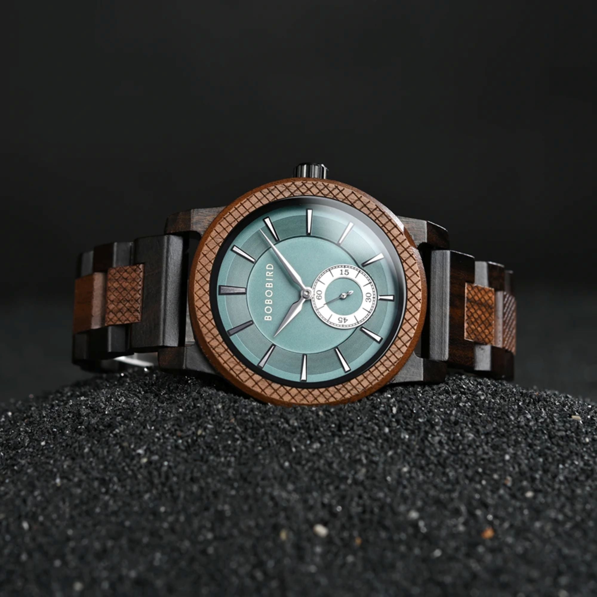 Wooden watch with a blue face on a dark textured surface