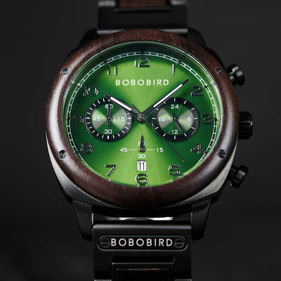 Bobo Bird chronograph watch with a green dial, dark wood bezel, and black metal case on a dark background.