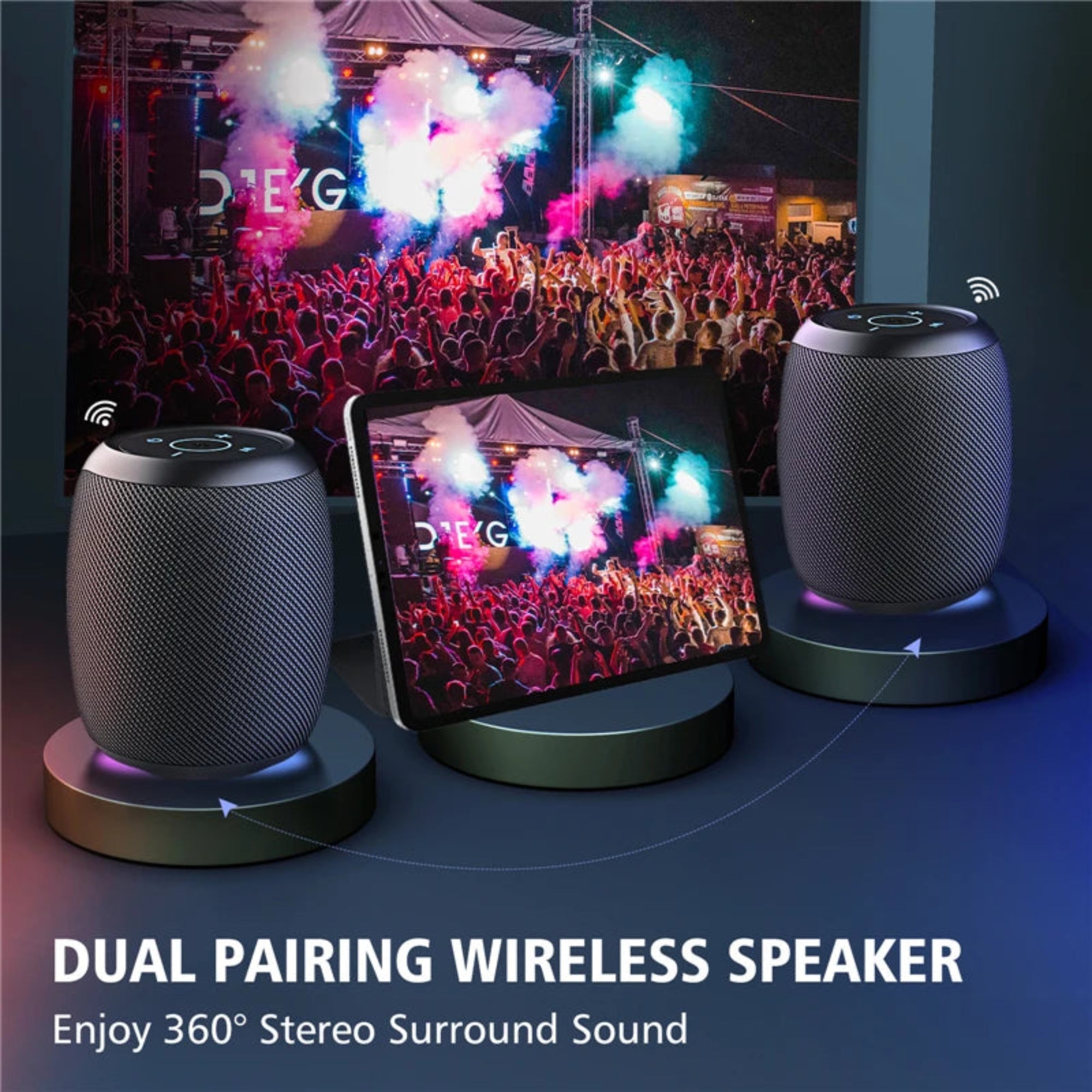 Dual pairing wireless speakers with a tablet displaying a concert scene, emphasizing stereo sound quality.