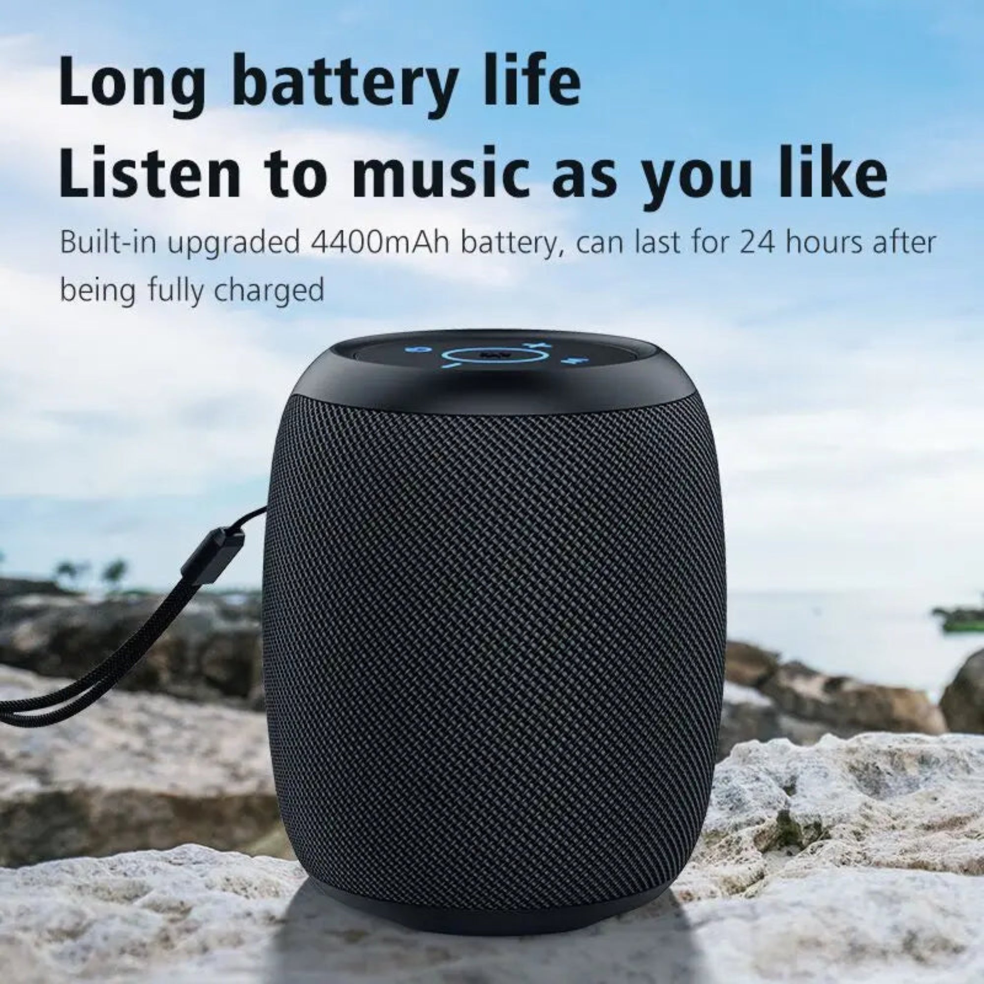 Black portable speaker on a rocky surface with text about long battery life and music listening capabilities.