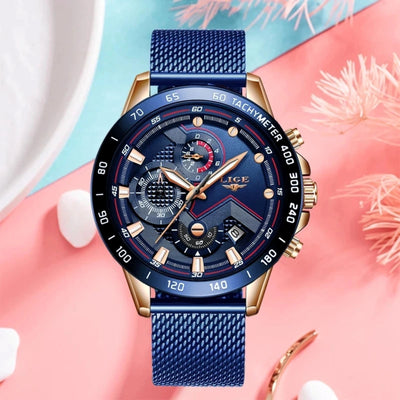 Blue and gold watch on a colorful background