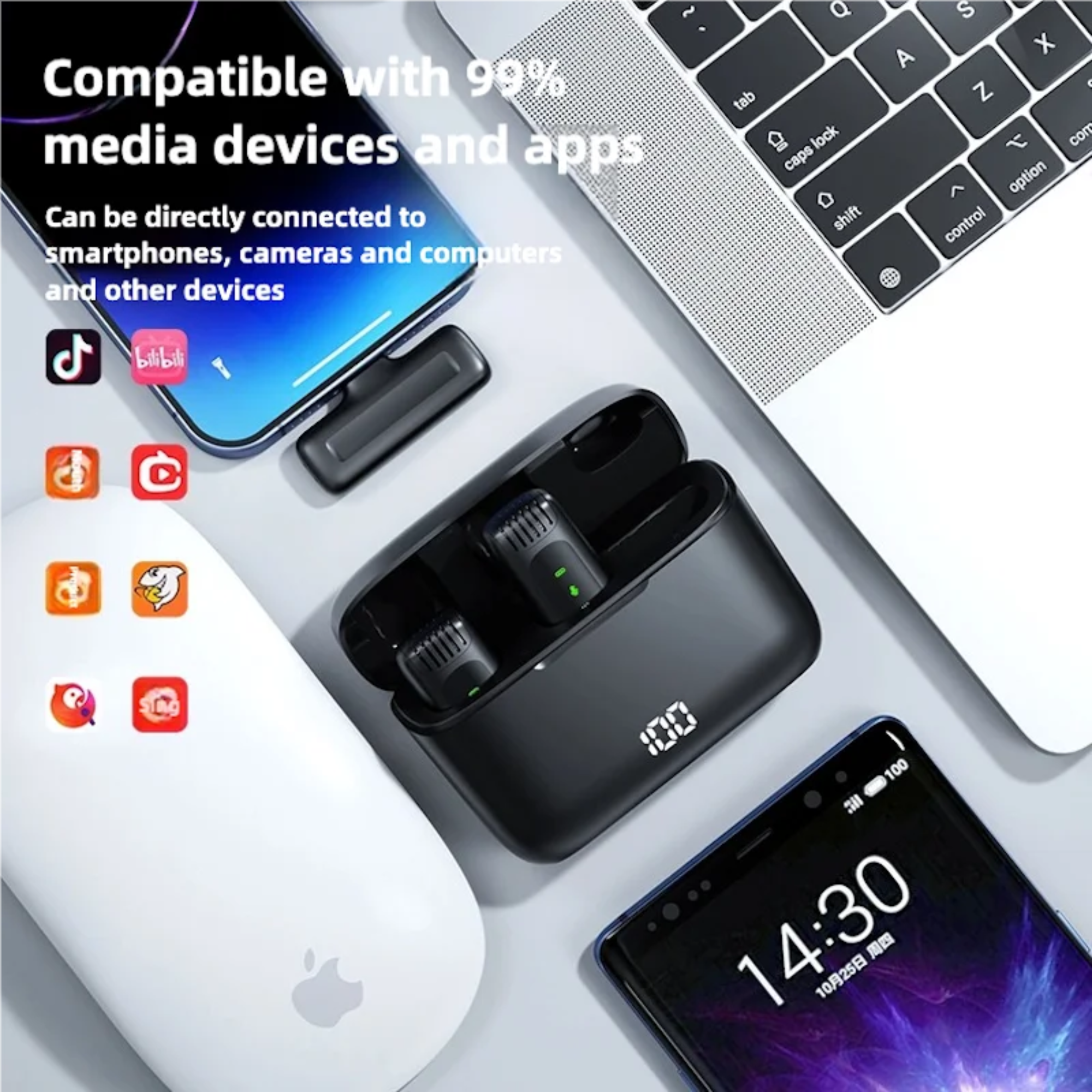 Black electronic device with connectivity features on a white surface with smartphone and laptop.