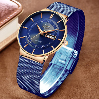 Blue watch with gold accents on a brown background