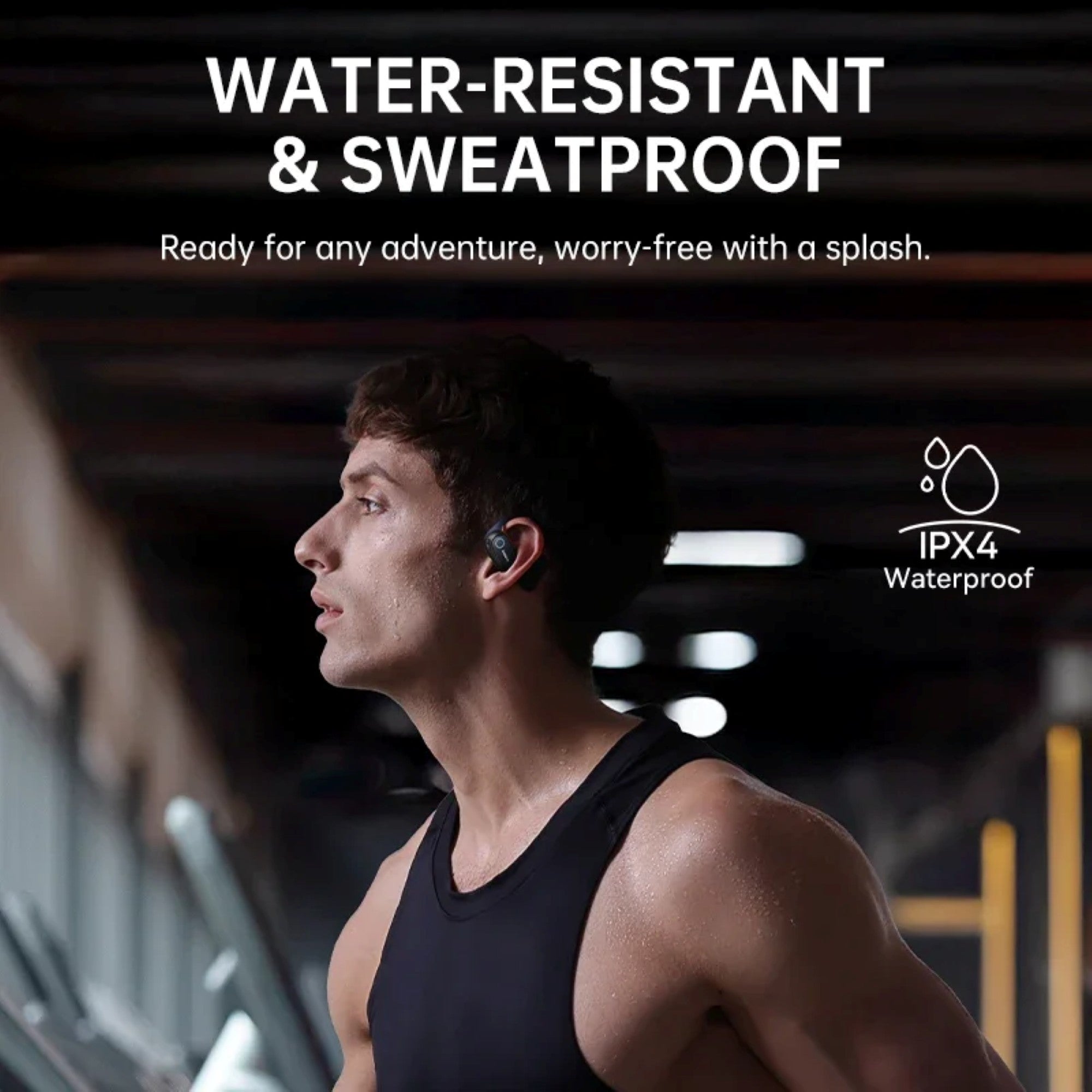 Man wearing a black tank top with text about water-resistant and sweatproof features.