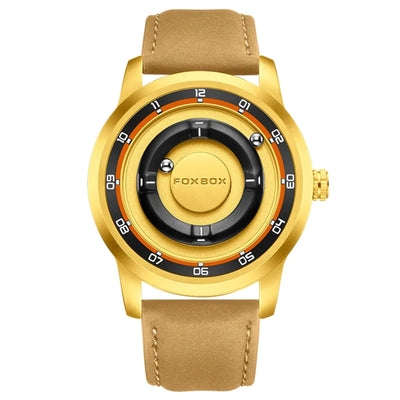 A gold-tone wristwatch with a tan leather strap, featuring a unique multi-ring dial with black and orange accents and white numerals.
