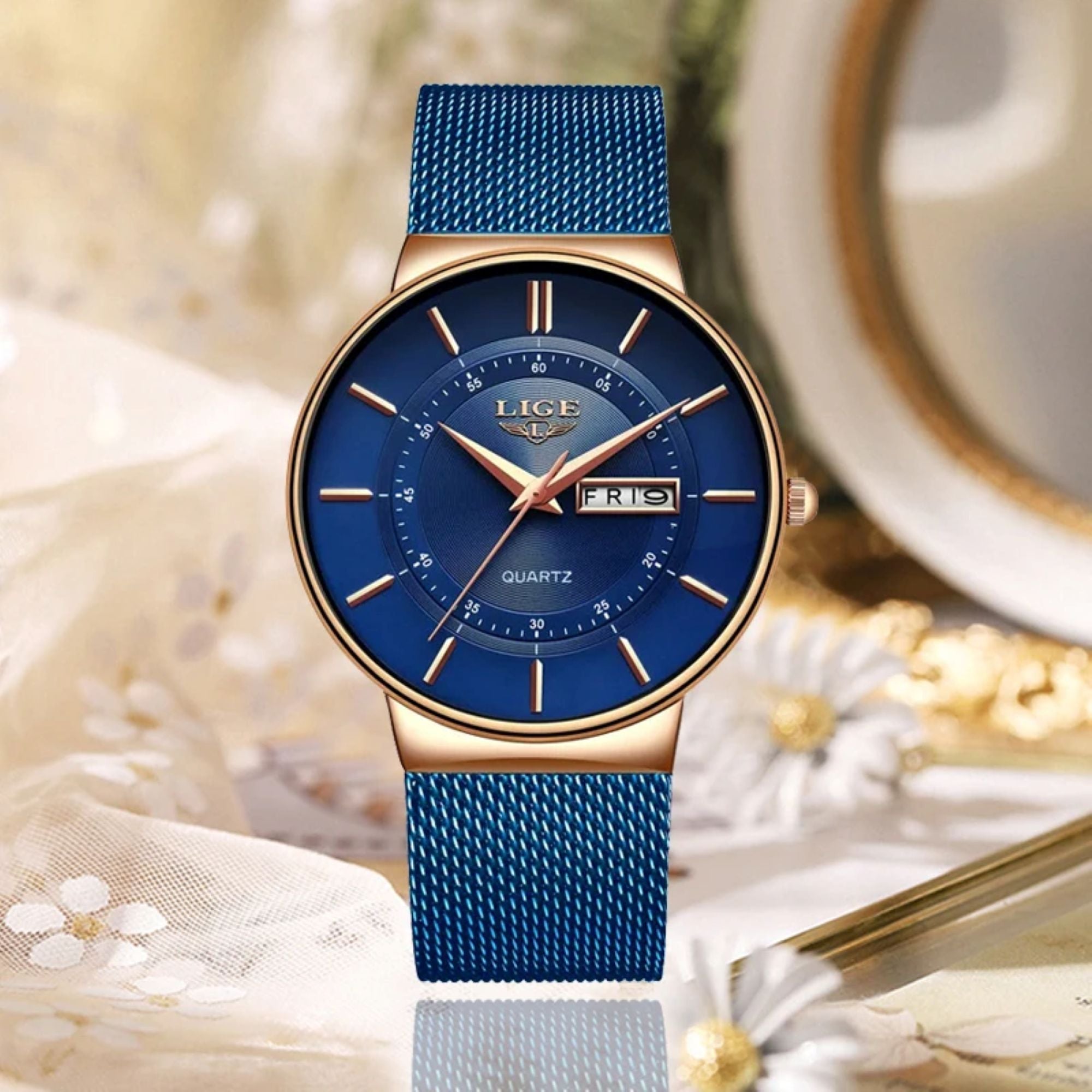 Blue watch with gold accents on a decorative background