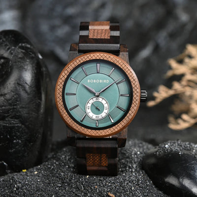 Wooden watch with a green face on a dark surface