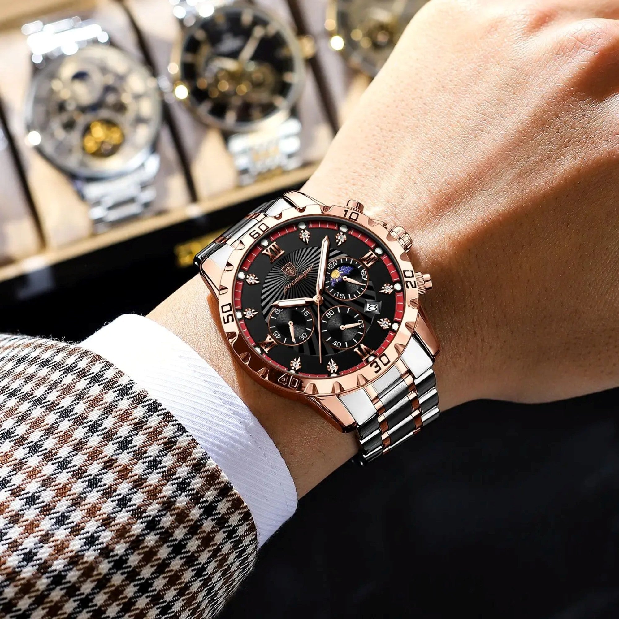 Close-up of a person's wrist wearing a rose gold and black watch with a blurred background.