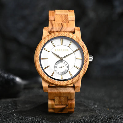 A watch with a green dial and wooden strap, featuring a patterned bezel and analog hands.