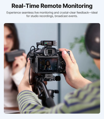 Person holding a camera with real-time remote monitoring feature in a studio setting.