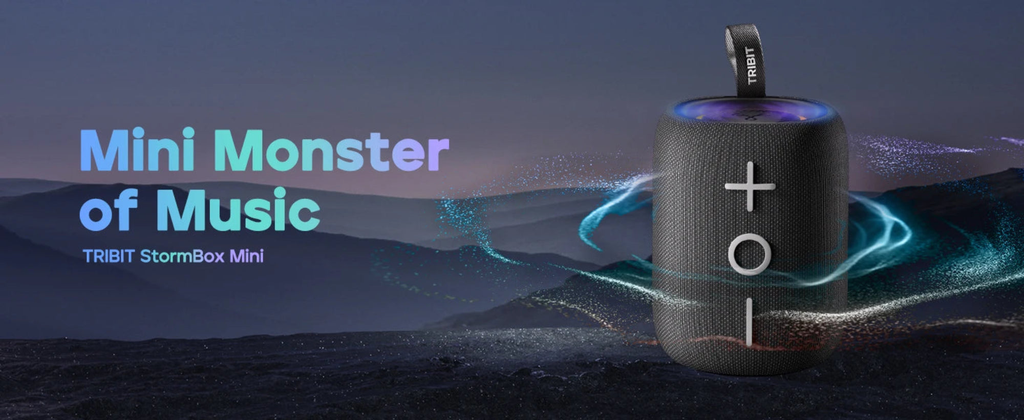 Tribit StormBox Mini Bluetooth speaker with mountainous landscape background