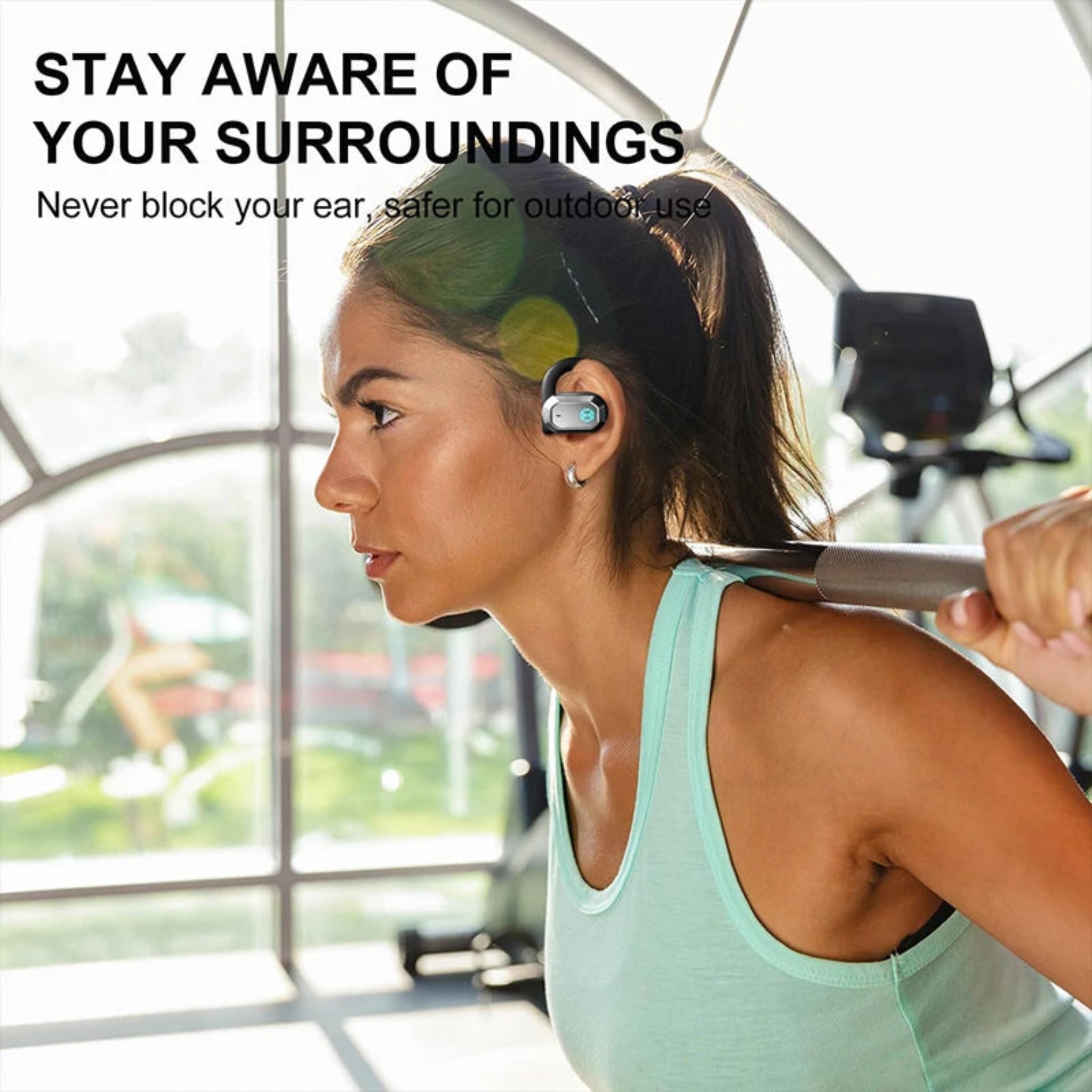 Woman exercising with earbuds on, text 'Stay aware of your surroundings', indoors.