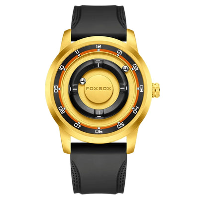 A gold-tone wristwatch with a black strap and a black dial featuring orange accents and white numerals. The brand name 'FOXBOX' is clearly visible on the center of the dial.
