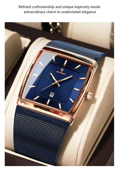 Luxury watch with blue strap and face on a beige surface