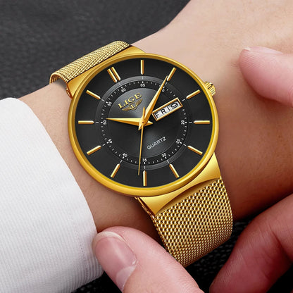 Gold wristwatch with black dial on a person's wrist