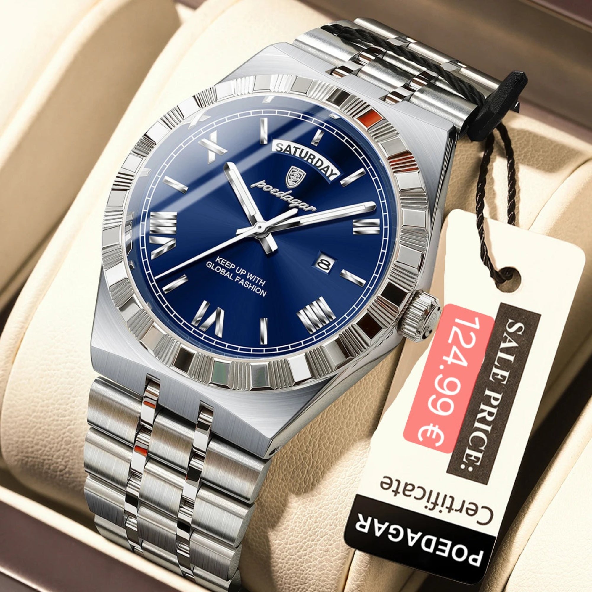 Silver watch with blue face and 'PODEGAR' branding on a beige cushion, with a price tag attached.
