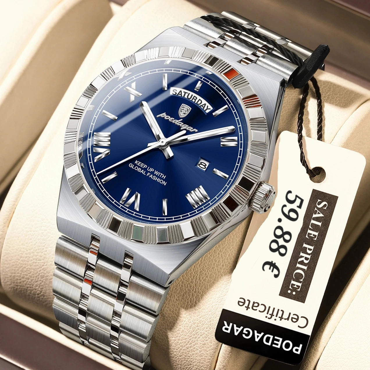 A silver stainless steel wristwatch with a blue dial and Roman numeral hour markers, presented in a beige watch box with a paper price tag attached.