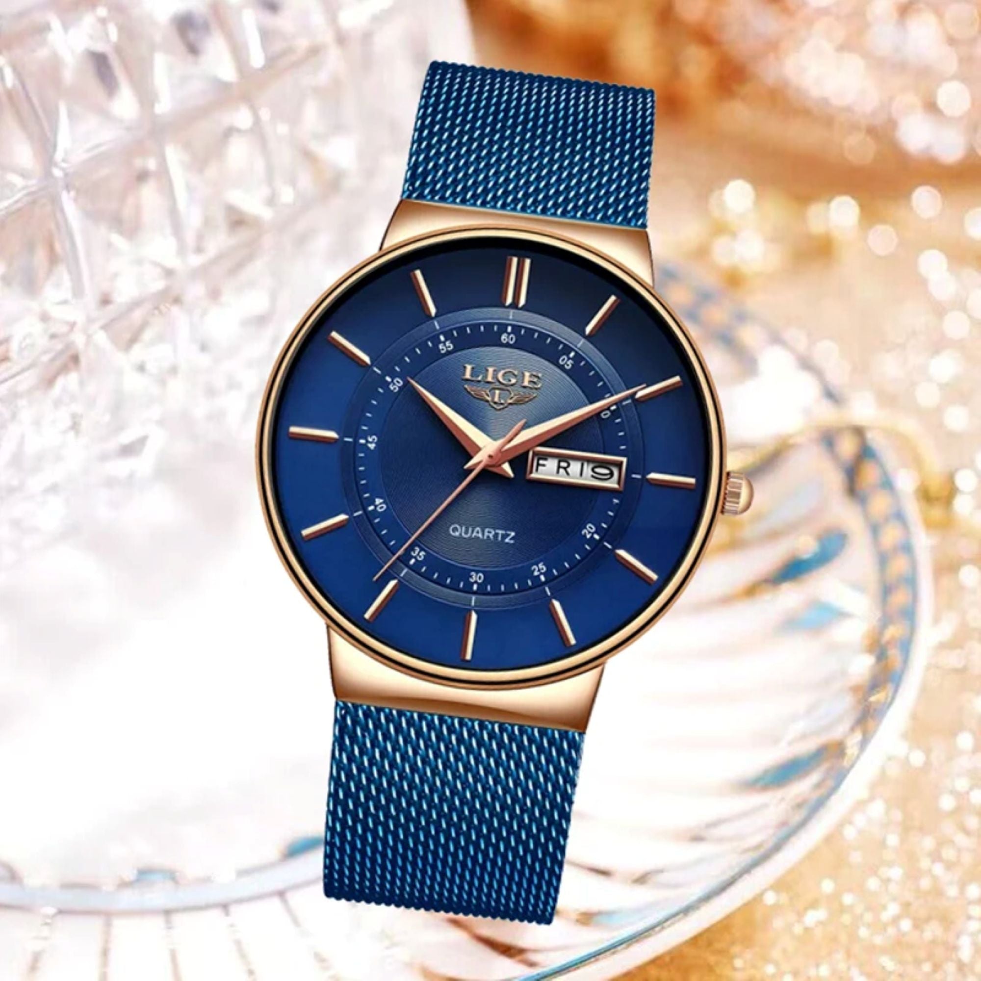 Blue watch with gold accents on a decorative background