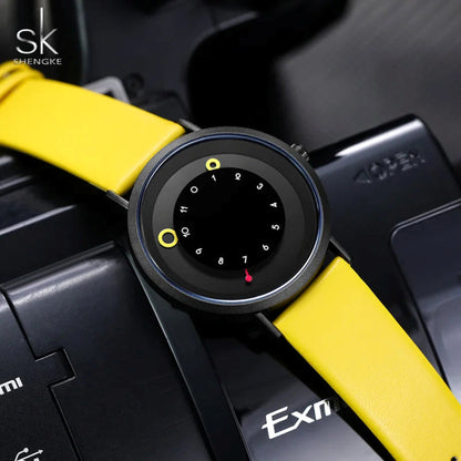 Close-up of a car's gear shift lever with a yellow accent, featuring the Shengke brand.