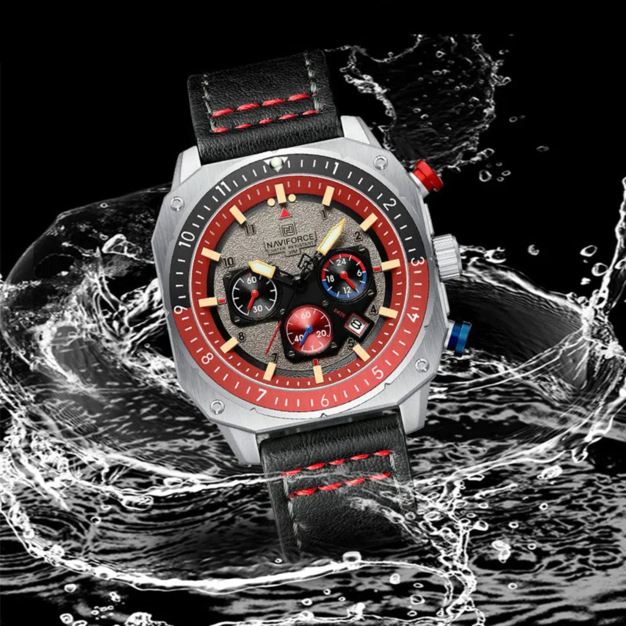 Wristwatch with red and black design on water surface