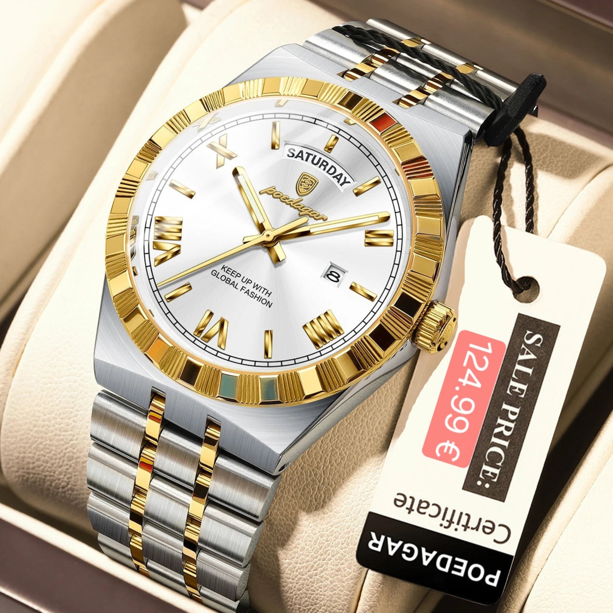 Silver and gold watch with a visible price tag on a beige cushion