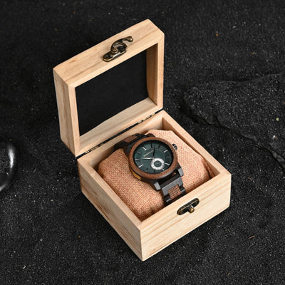 Wooden watch box with a wooden watch inside on a dark textured background