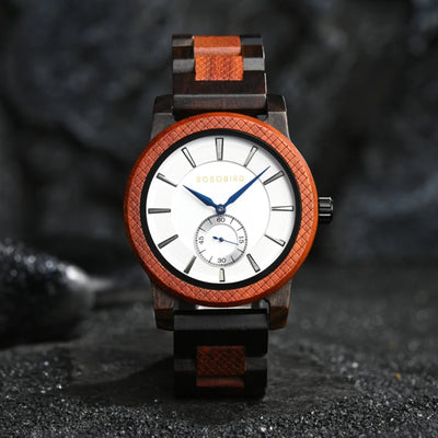 A watch with a green dial and wooden strap, featuring a patterned bezel and analog hands.