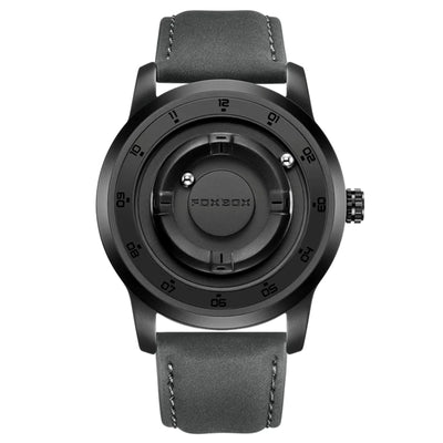A black analog watch with a round bezel, black case, and a dark gray textured strap, shown against a plain white background. The brand name 'FOXZON' is visible on the center dial.