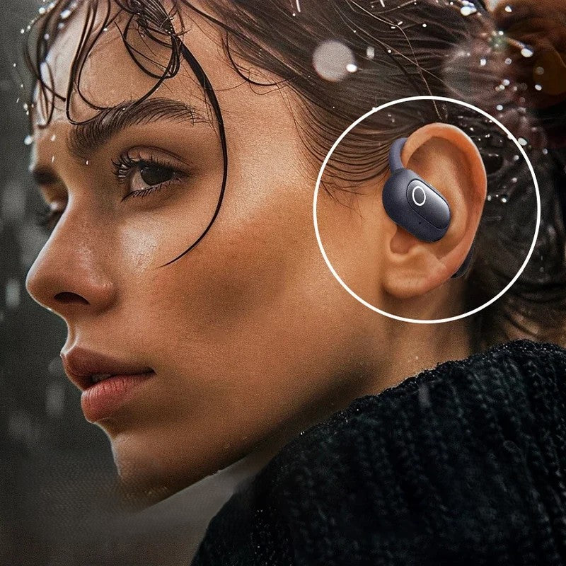 Close-up of a person wearing a black wireless earbud in the rain