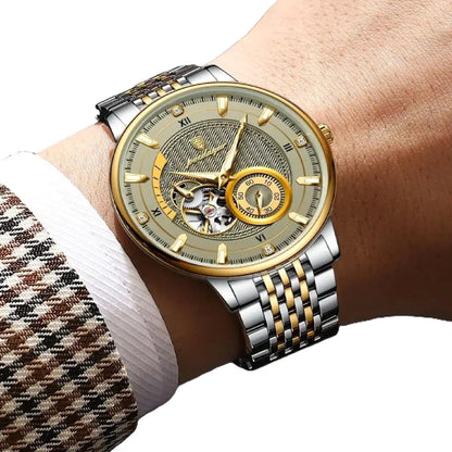 Luxury watch with a gold and silver strap on a wrist, against a neutral background.