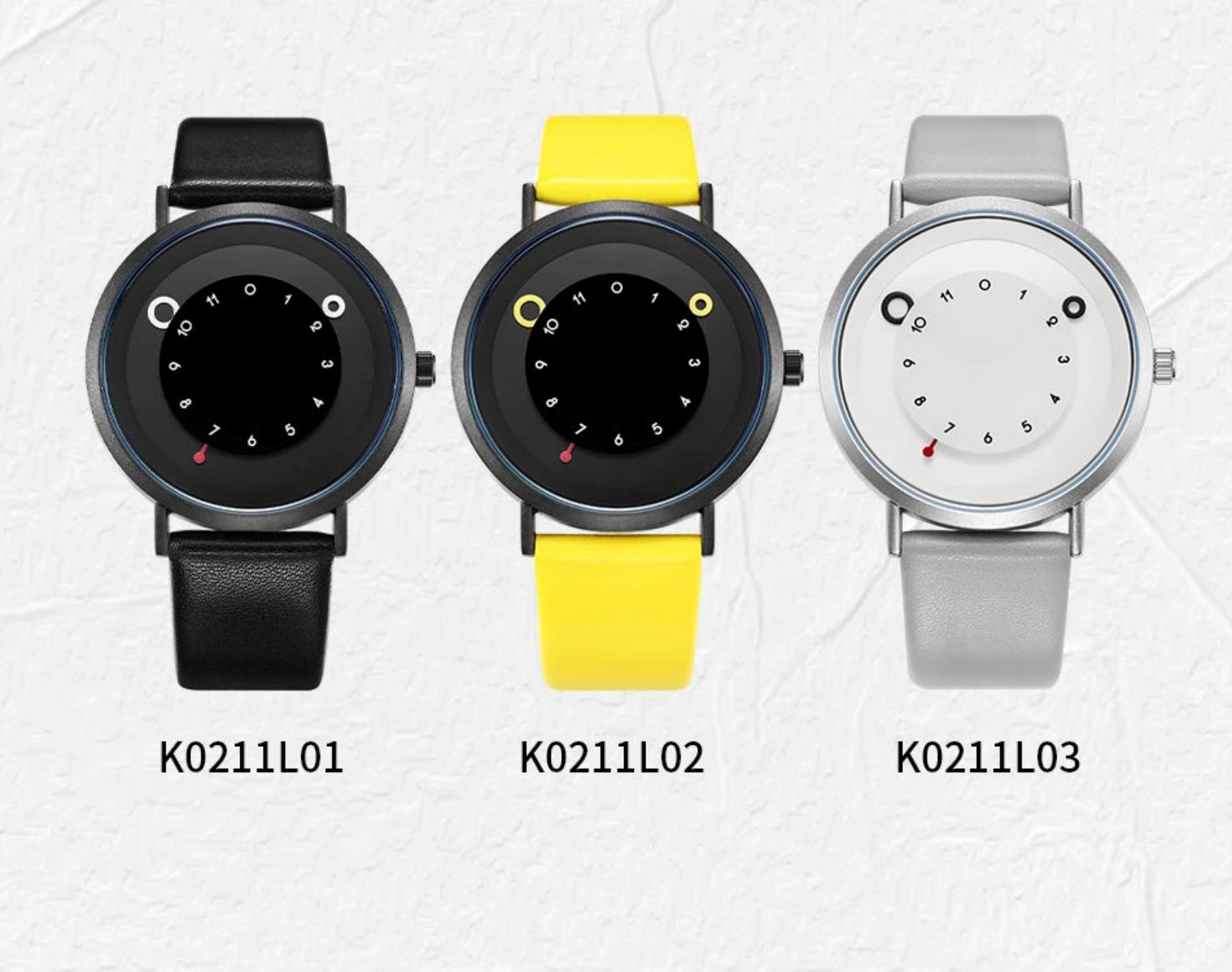 Three watches with different colored straps on a light gray background