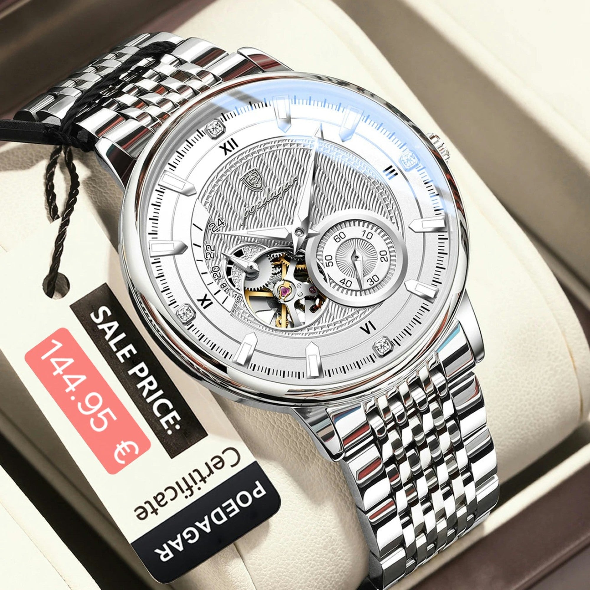 Silver wristwatch with visible mechanism on a beige cushion, accompanied by a sale price tag and certificate.