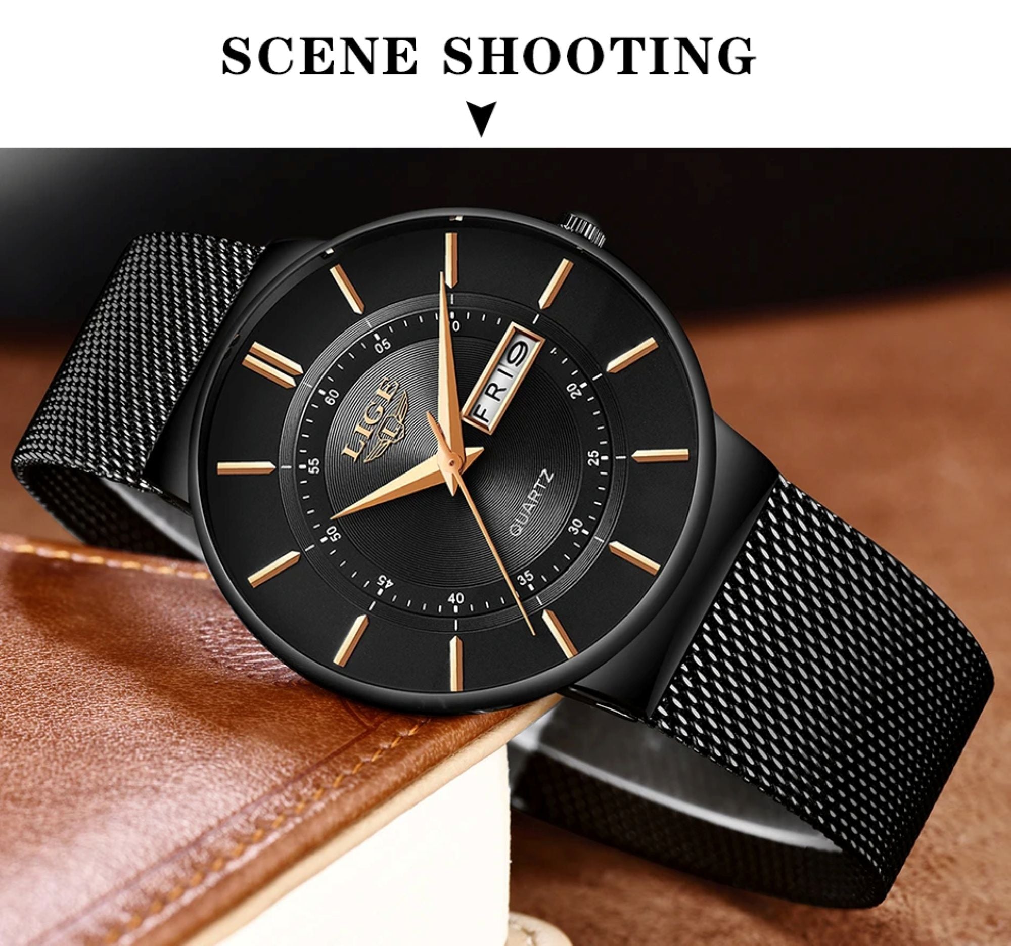 Black watch with gold accents on a brown leather surface