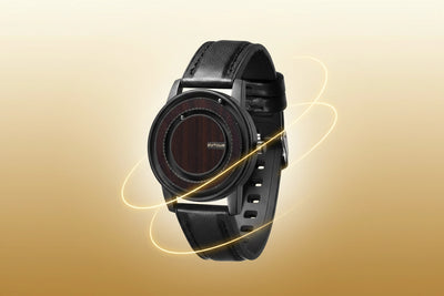 A black smartwatch with a round dark wood-grain face and a black strap, shown floating against a warm beige-to-brown gradient background with glowing light streaks.