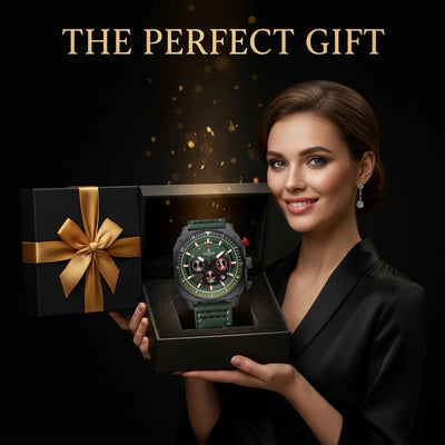 A woman in a black satin blazer holds an open black gift box displaying a rugged green watch with a dark dial. A closed black gift box with a gold ribbon bow sits beside it, and the text 'THE PERFECT GIFT' appears at the top against a dark background with subtle gold bokeh.
