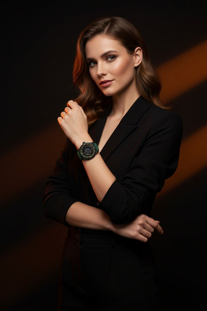 Woman wearing a black blazer and a black watch against a dark background
