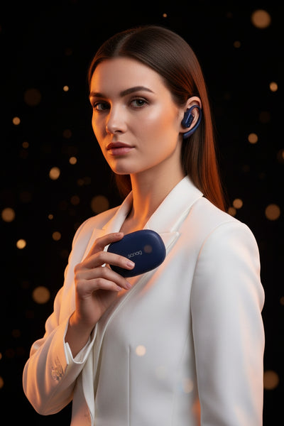 Woman wearing wireless earbuds with a dark, blurred background
