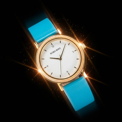 Watch with blue strap and gold casing on a dark background