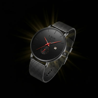 Black wristwatch with red accents on a dark background