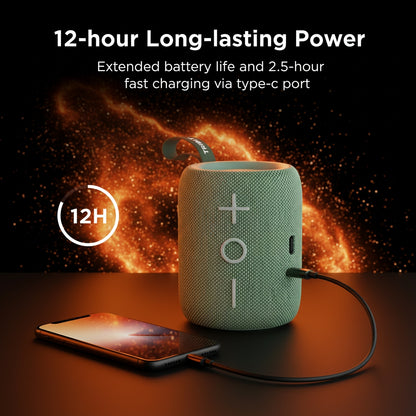Green portable speaker with charging cable and phone on a dark background with fiery effect