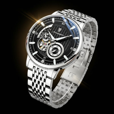 Silver wristwatch with a black face on a dark background