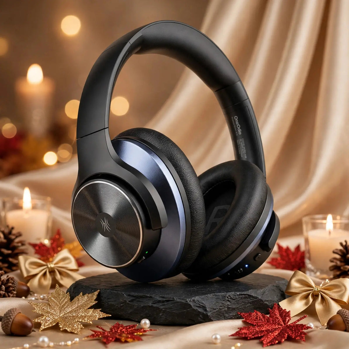 One0dio A10 black blue headphones correct model with brushed circular metal and silver logo on black slate stone with champagne satin silk, gold and red glitter maple leaves, gold bows, acorns and candles, luxury autumn background