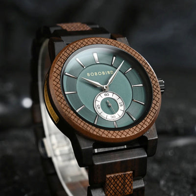 Wooden watch with a green face and brown strap on a dark background